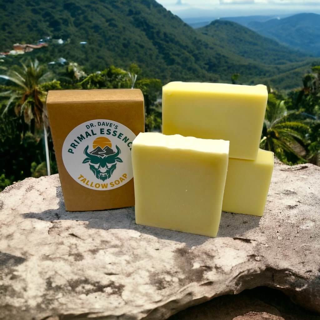 Three handcrafted soap bars stacked with a textured creamy surface.